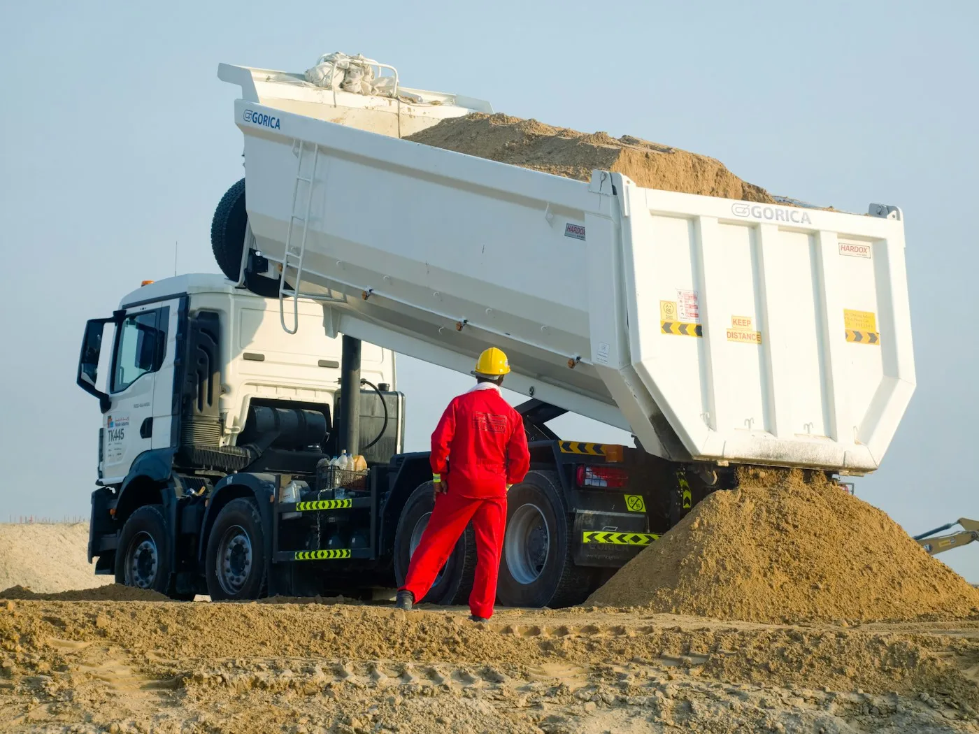 Tipper truck unloading loose material